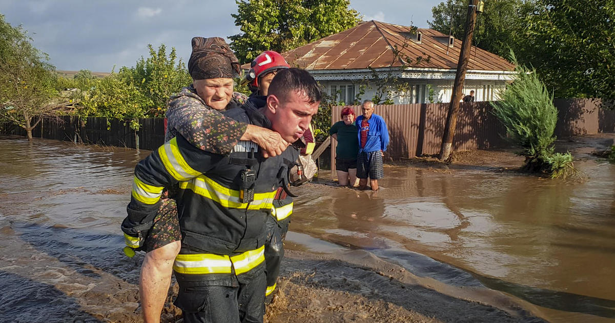 4 deaths reported in eastern Romania as torrential rainstorms flood homes, block roads