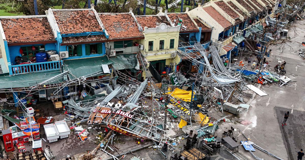 Typhoon Yagi hits Vietnam with torrential rains, killing almost 60 as vehicles and a bridge are swept away