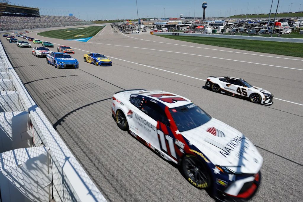 Tyler Reddick passes Kyle Larson on the final lap of OT to win NASCAR Cup Series race at Kansas