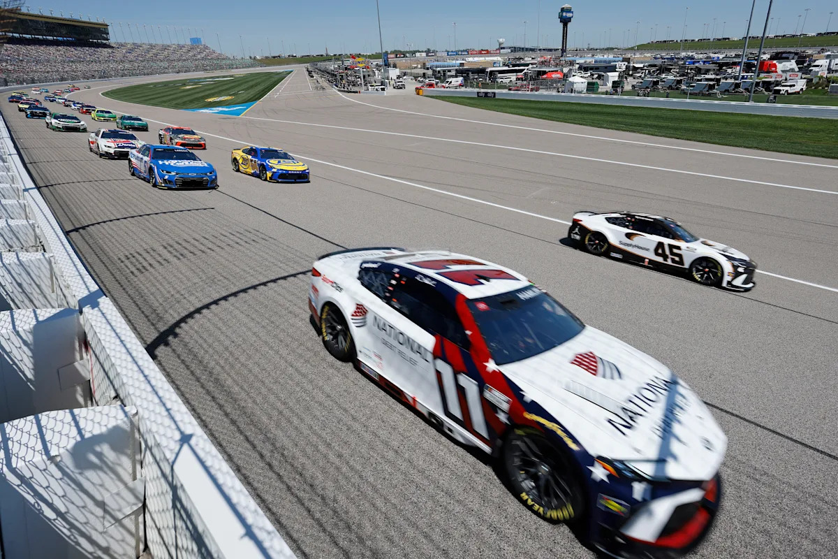 Tyler Reddick passes Kyle Larson on the final lap of OT to win NASCAR Cup Series race at Kansas